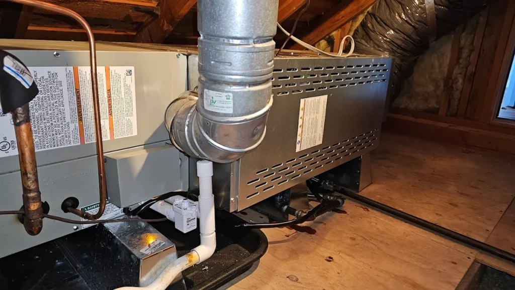 Residential HVAC air handler in attic connected to ductwork, showing proper setup for treated fresh air ventilation